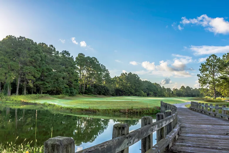 Thistle Golf club with wooden bridge and green in background