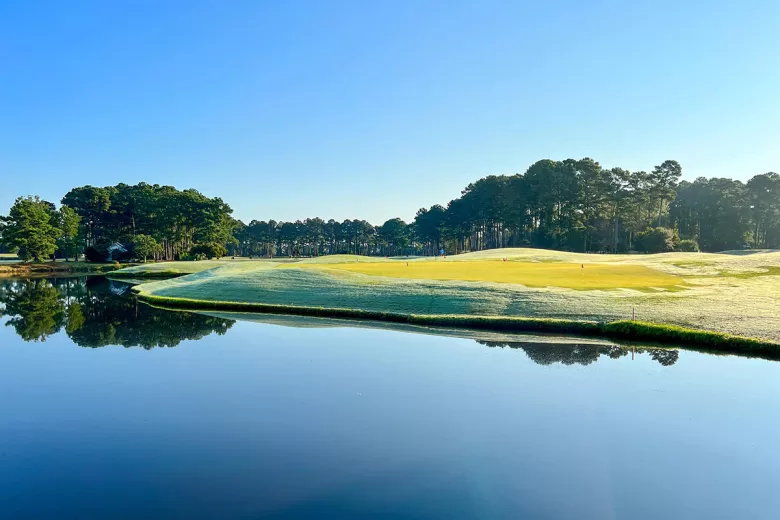 World Tour Golf sunrise view of green with lake