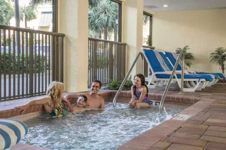 Family sitting in hot tub. Photo 8