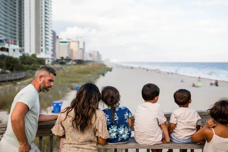 Family Enjoying Myrtle Beach Boardwalk Photo 3