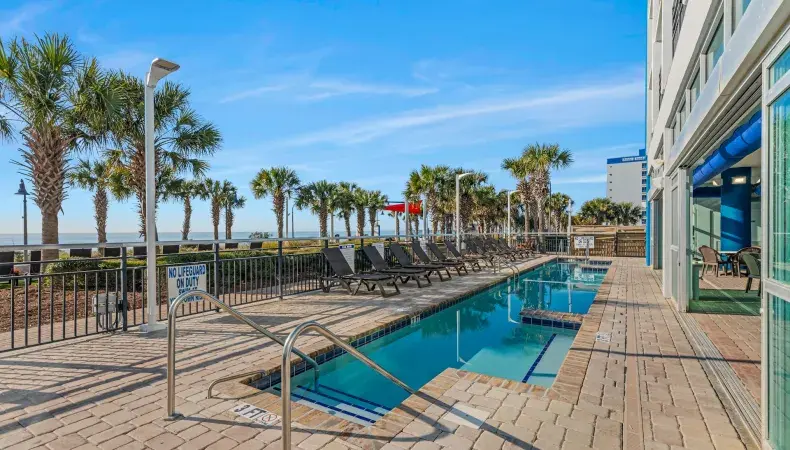 Outdoor pool area with ocean view Photo 9