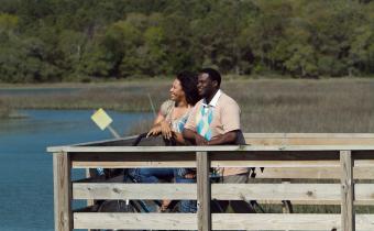 Couple at Huntington Beach and marsh view
