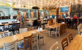 Makai Brewing interior with tables and bar