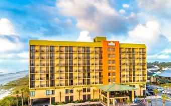 Surfside Beach Oceanfront Hotel building aerial with beach