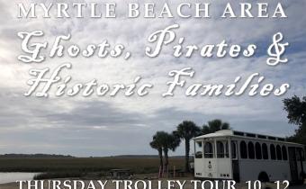 White trolley sitting along the inlet in Murrells Inlet