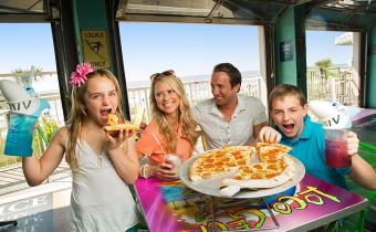 Family eating pizza having fun