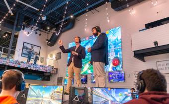 Hosts on stage at eSports event