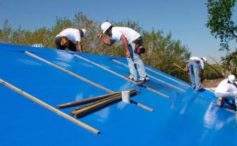 Crew works on house for disaster relief