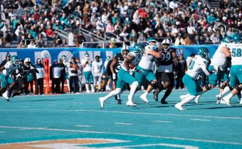 Players on field from the Myrtle Beach Bowl Game