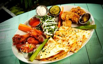 Senor Frogs delicious enchilada, wings and jalapeno platter