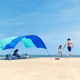 Family on beach with Shibumi Shade