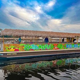 PonTiki Myrtle Beach tour boat with tiki roof and colorful graphics