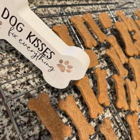 Dog treats with Dog Kisses sign in shape of bone