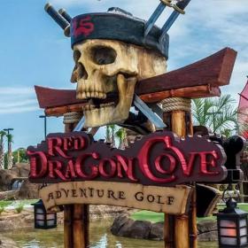 Red Dragon Cove Adventure Golf sign with pirate skull