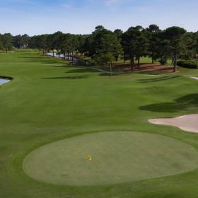 Pinehills fairway with traps, greens and golf cart path