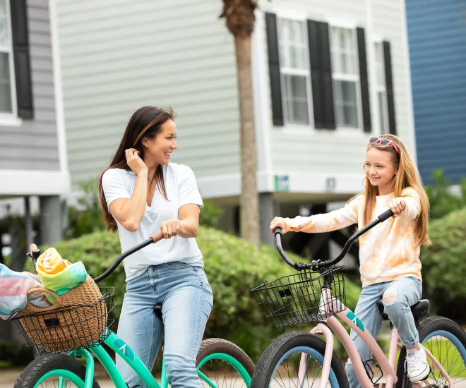 Mom and daughter ride bikes