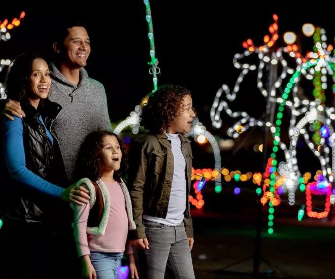 Family enjoying Christmas lights at Winter Wonderland at The Beach