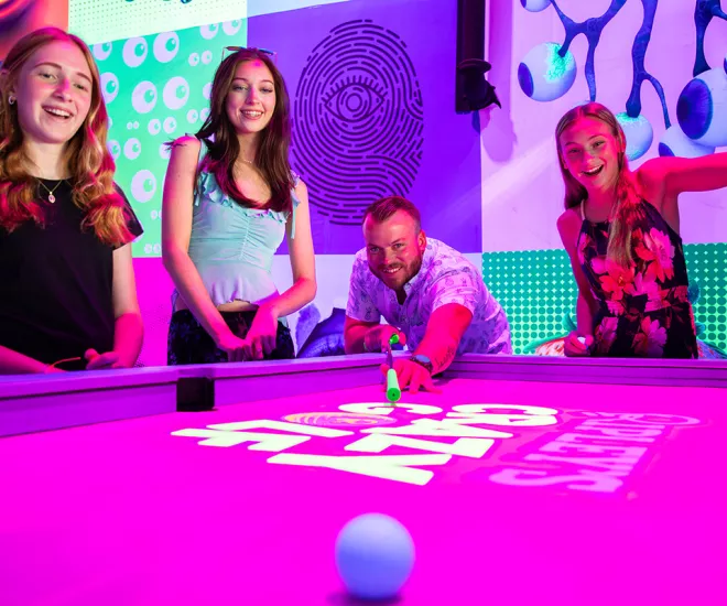 Ripley's Crazy Golf family at golf pool table