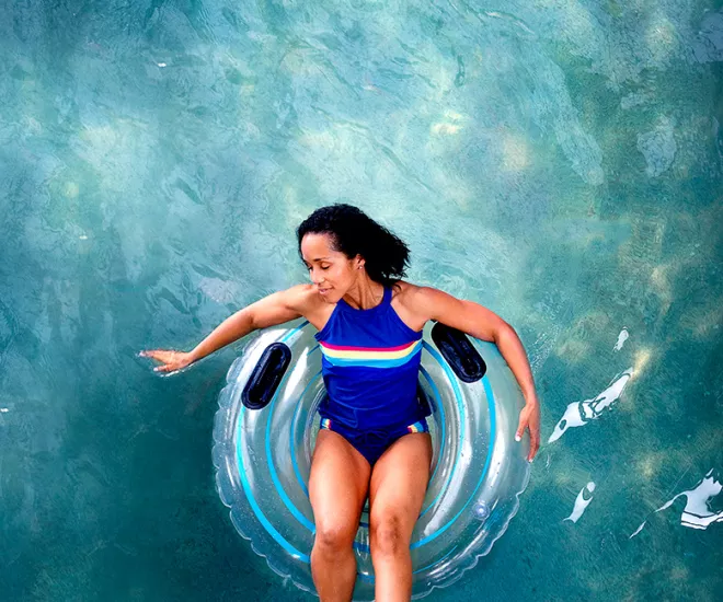 Woman relaxing on a pool float.