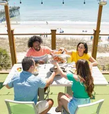 Family eating outside at a table