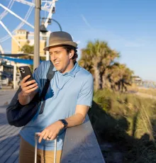 Man taking a business call at the beach