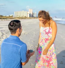 Couple getting engaged on the beach