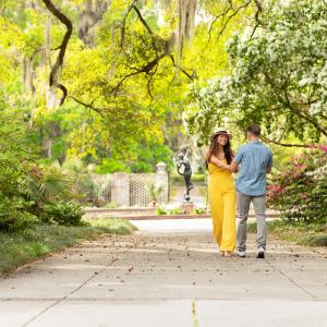 Couple walking through Brookgreen Gardens