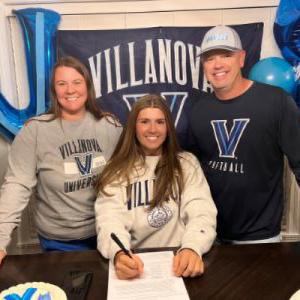 Villanova fans working a registration table