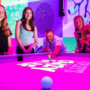 Ripley's Crazy Golf family at golf pool table