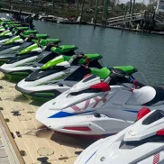 Crazy Sister Marina jet skis lined up on water