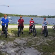 5 people on Electric Bike tour with lake in background