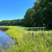 Colonial Charters Golf Club fairway and green with water feature