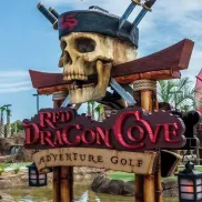 Red Dragon Cove Adventure Golf sign with pirate skull