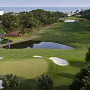 Dunes Golf aerial with ponds, greens, traps and ocean