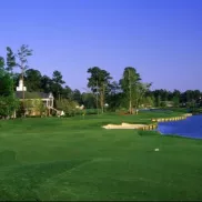 Long Bay Club clubhouse overlooking water with greens