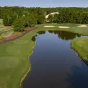 Meadowland aerial with large lake and fairways on each side