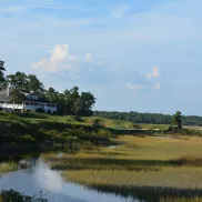 River's Edge Golf with stream and club house