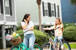 Mom and daughter ride bikes