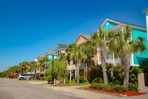 Ocean Blvd. in Surfside Beach with colorful homes and palm trees