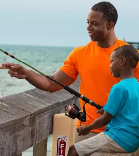 Dad and Son Pier Fishing