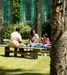 People sitting on benches at Atalaya Castle