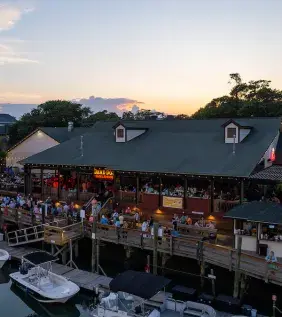 MarshWalk drone shot with the sunset over the restaurants