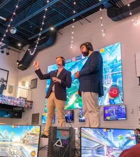 Hosts on stage at eSports event