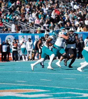 Players on field from the Myrtle Beach Bowl Game