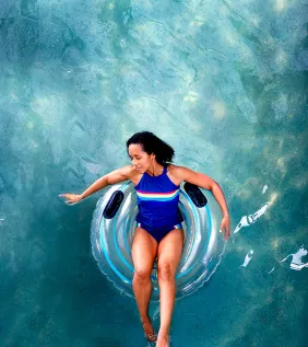 Woman relaxing on a pool float.