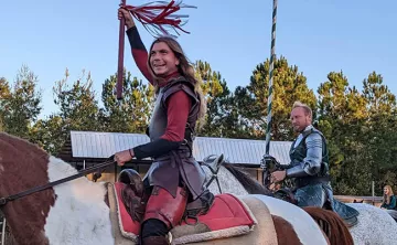 Men ready to joust on horses