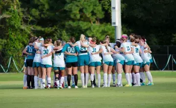 CCU Women's Soccer team in a huddle