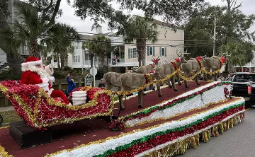 Santa and his sleigh riding in the Surfside Beach Christmas Parade