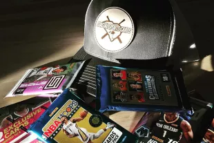 Hat with Coastal Sports Cards logos and various sports cards