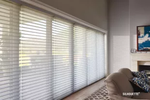 Living room with large windows with blinds